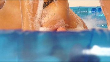 Big tits lesbian showing pussy in the pool